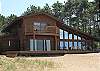Kay Ray Cottage with private shared 253 feet of lake frontage with views of Old Mission Peninsula. Nice sandy beach, fire pit and dock.