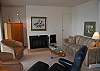 Living room with fireplace, sofa bed and lake view