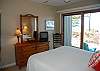 Master bedroom with queen bed and lake view