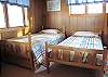 1/2 bedroom with two twin beds off of the 2nd bedroom on the second floor