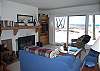 Living room with fireplace and lake view