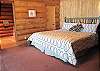 Master bedroom with king bed, private bath and attached sunroom on the main floor