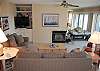 Living room with fireplace, sofa bed and lake view