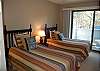2nd bedroom with two twin beds and private deck