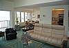 Living room, kitchen and dining room, all with lake view