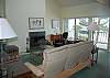 Living room with fireplace and lake view