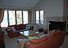 Living room with fireplace and lake view