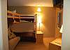 3rd bedroom with one set of twin bunk beds plus one set of full futon/twin bunk beds on the lower level