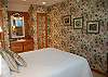 3rd bedroom with queen bed and lake view on the second floor