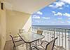 The private balcony features a table with seating for 4, and offers exceptional views of the Gulf of Mexico.
