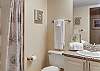 Bathroom 2 offers a single vanity, a standing shower, and is fully stocked with linens for your stay.