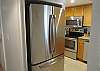 The kitchen provides a stainless refrigerator with ice maker.
