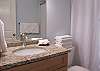 A guest bathroom is convenient to the living area and also Guest bedroom 1. It features a tub/shower combo, single vanity, and is fully stocked with linens for your stay.