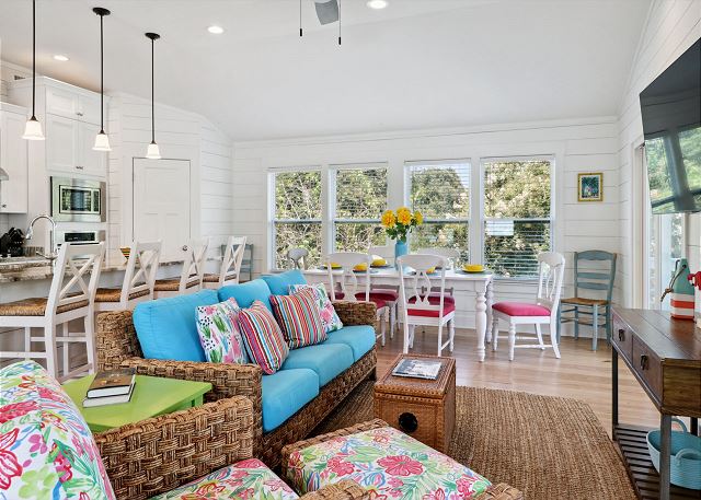 The open floor plan welcomes guests with colorful accents & lots of natural light!