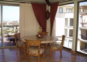The penthouse's sunny dining area, with ocean view.