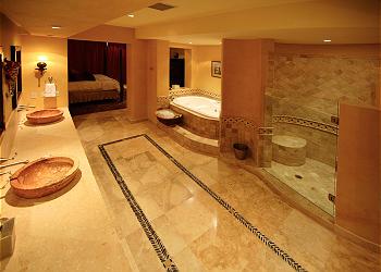 Master Bedroom with Jacuzzi Tub, Shower and Walk-in Closet.