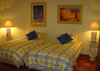The condo's third bedroom with two twin beds or one king.