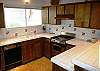 Full kitchen, dishwasher, tile countertop.