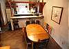 Dining area with seating for six, plus bar area with seating for four.