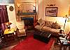 Custom wood fireplace, upgraded tile flooring, vaulted ceilings.