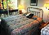 King bed, plenty of light, attached private bathroom.