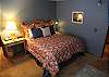 Large master bedroom furnished with King bed and private bath.