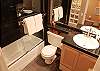 Shower/tub combo, granite throughout.