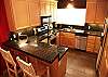 Recently renovated, full kitchen, granite countertops, dishwasher, stainless steel appliances, upgraded tile floor.