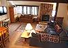 Light and bright living area with sectional sofa.