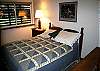 Queen bed, wood furnsihings.