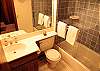 Shared bathroom, shower/tub combo.