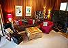 Beautiful custom fireplace, natural wood tones, convertible couch.