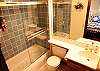 Attached master bath, shower/tub combo.