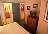 TV in the master bedroom, with attached bathroom.