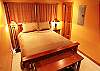 Queen bed, neutral tones, attached private bath.