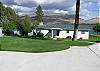 Parking pad is design to accommodate an RV.  Large and Flat.  Chief Cliff rock formation is hidden by the pine tree.