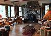 Living room with great river rock fireplace.