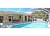 Pool deck and pool with outdoor seating and barbecue