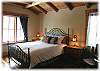 One of the guest bedrooms with queen size bed