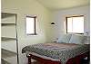 Queen size bed in the guest cottage