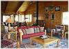 A cozy living room adjoins the kitchen and dining area