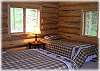 The second bedroom on the main floor with a queen and a twin
