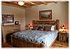 One of the home's gorgeous master bedrooms with king size bed, luxury linens and private bath