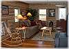 The cozy living room has a pull out sofa for extra guests