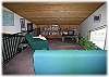 The loft area (accessed by a ladder) over the living room, with TV and VCR