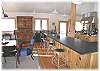 Overflow from the dining area can sit at the kitchen counter barstools