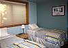 Twin beds in the lower level bedroom