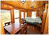"Cubby's" screened in porch with a queen bed