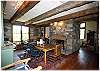 Dining room with a stone fireplace