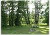 A community picnic area with pond and paddle boat down at the bottom of the road